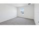 Bedroom features plush carpet, a window with natural light, and neutral paint at 1844 Draughton Dr, Zephyrhills, FL 33541