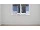 Bedroom with light wood floors and a window for natural light at 1844 Draughton Dr, Zephyrhills, FL 33541
