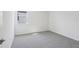 Bedroom features plush carpet, a window with natural light, and neutral paint at 1844 Draughton Dr, Zephyrhills, FL 33541