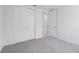 Bedroom features plush carpet, a large closet, and neutral paint at 1844 Draughton Dr, Zephyrhills, FL 33541