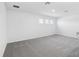 Large bonus room features plush carpet, recessed lighting, and a lot of natural light at 1844 Draughton Dr, Zephyrhills, FL 33541