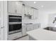 Well-equipped kitchen with stainless steel appliances, ample counter space, and stylish cabinetry at 1844 Draughton Dr, Zephyrhills, FL 33541