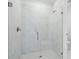 Contemporary shower featuring a glass door, sleek fixtures, and clean lines at 1844 Draughton Dr, Zephyrhills, FL 33541