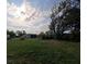 Expansive backyard with mature trees, offering a private and serene outdoor space at 201 Ravenna N St, Nokomis, FL 34275