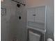 Bathroom featuring marble-style tiles on shower and toilet and cabinet at 201 Ravenna N St, Nokomis, FL 34275