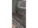 Tile floor of bathroom showing hex tile floor and gray tile at 201 Ravenna N St, Nokomis, FL 34275