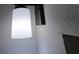Modern bathroom light fixture with white shade and dark mounting at 201 Ravenna N St, Nokomis, FL 34275