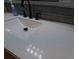 Modern bathroom features white quartz countertop and dark hardware at 201 Ravenna N St, Nokomis, FL 34275