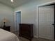 Bedroom with wood floors, dresser, and natural light at 201 Ravenna N St, Nokomis, FL 34275