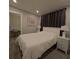 Bedroom featuring a bed, nightstands, and desk nook at 201 Ravenna N St, Nokomis, FL 34275