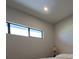 Bright bedroom features a picture window with views of nature and accent lamp at 201 Ravenna N St, Nokomis, FL 34275