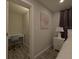 Bedroom with desk nook, nightstand, lamp and abstract wall art at 201 Ravenna N St, Nokomis, FL 34275
