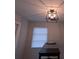 Dining room with modern, caged pendant light fixture and a window with blinds at 201 Ravenna N St, Nokomis, FL 34275