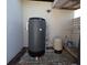 Outdoor water system equipment showing a water filter system, pressure tank and plumbing at 201 Ravenna N St, Nokomis, FL 34275