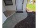 Close up of front door with decorative concrete step leading up to the entrance at 201 Ravenna N St, Nokomis, FL 34275