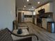 Modern kitchen with stainless steel appliances, white cabinets, and a grey tile backsplash at 201 Ravenna N St, Nokomis, FL 34275