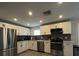 Modern kitchen featuring stainless steel appliances, white cabinetry, and gray subway tile backsplash at 201 Ravenna N St, Nokomis, FL 34275