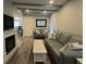 Cozy living room with a fireplace and stylish decor, perfect for relaxation at 201 Ravenna N St, Nokomis, FL 34275