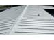 Metal roof with standing seams running vertically down the slope at 201 Ravenna N St, Nokomis, FL 34275