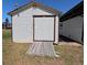 Exterior shot of the backyard shed with ramp at 201 Ravenna N St, Nokomis, FL 34275