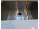 Close-up of stainless steel sink with modern countertops, providing a sleek and functional kitchen detail at 201 Ravenna N St, Nokomis, FL 34275