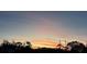 Scenic sunset view with colorful sky over the neighborhood, perfect for relaxing evenings at 201 Ravenna N St, Nokomis, FL 34275
