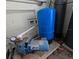 Image of the home's well pump and pressure tank, ensuring reliable water supply at 201 Ravenna N St, Nokomis, FL 34275
