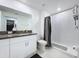 Modern bathroom featuring a walk-in shower and granite countertops at 36495 Garden Wall Way, Zephyrhills, FL 33541