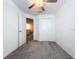 Bedroom with a ceiling fan, carpet, and closet access at 36495 Garden Wall Way, Zephyrhills, FL 33541