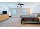 Spacious bedroom with neutral carpet, ceiling fan, and large windows at 36495 Garden Wall Way, Zephyrhills, FL 33541
