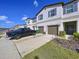 Well-maintained townhouse with attached garage and landscaped yard at 36495 Garden Wall Way, Zephyrhills, FL 33541