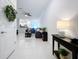 Spacious living area with tiled floors and an open-concept layout at 36495 Garden Wall Way, Zephyrhills, FL 33541