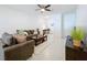 Cozy living room with tile flooring and lots of natural light at 36495 Garden Wall Way, Zephyrhills, FL 33541