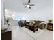 Bright living room featuring a comfortable seating area and modern decor at 36495 Garden Wall Way, Zephyrhills, FL 33541