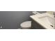 Well lit bathroom featuring a quartz countertop and gray vanity at 5521 80Th Street North # 306, St Petersburg, FL 33709