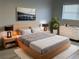 Stylish bedroom featuring a modern platform bed and minimalist decor at 5521 80Th Street North # 306, St Petersburg, FL 33709