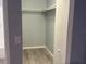 Open closet with rod and shelf, highlighting the storage space and organization options available at 5521 80Th Street North # 306, St Petersburg, FL 33709