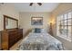 Bedroom with a queen-sized bed, large dresser, and a serene atmosphere with lots of natural light at 116 S Obrien St, Tampa, FL 33609