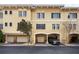 Townhome with attached garages and parking, featuring stylish architecture and an inviting facade at 116 S Obrien St, Tampa, FL 33609