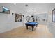 Well-appointed game room featuring a pool table and wall-mounted television at 116 S Obrien St, Tampa, FL 33609