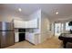 Modern kitchenette equipped with white cabinets and stainless-steel appliances at 116 S Obrien St, Tampa, FL 33609