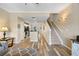 Open floor plan blending the kitchen and living area with modern flooring, neutral colors, and natural light at 116 S Obrien St, Tampa, FL 33609