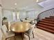 Cozy living area with staircase, dining table, hardwood floors, and modern furniture at 116 S Obrien St, Tampa, FL 33609