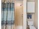 Tiled stand-up shower, toilet, and towel rack inside the bathroom at 116 S Obrien St, Tampa, FL 33609