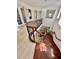 Elegant wooden staircase with wrought iron spindles and a curved design at 116 S Obrien St, Tampa, FL 33609