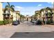 Inviting street view featuring a brick road, charming architecture, and lush landscaping with palm trees at 116 S Obrien St, Tampa, FL 33609
