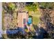 Aerial shot of a home featuring a private pool and spacious backyard, complemented by a neatly maintained lawn at 32589 Greenwood Loop, Wesley Chapel, FL 33545