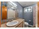 Bathroom featuring modern vanity, large mirror, and a shower/tub combination at 32589 Greenwood Loop, Wesley Chapel, FL 33545
