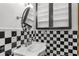 Modern black and white bathroom featuring vanity with contemporary sink and hardware at 32589 Greenwood Loop, Wesley Chapel, FL 33545