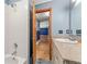Bathroom featuring a tub, granite counter tops, and a modern sink at 32589 Greenwood Loop, Wesley Chapel, FL 33545